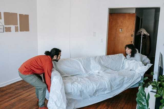 People lifting a couch