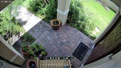 Outdoor security camera watching a front door and porch