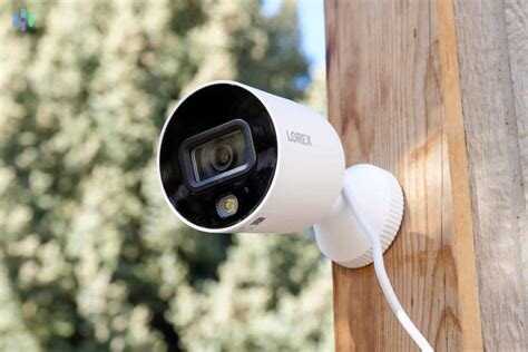 Weatherproof outdoor security camera monitoring a backyard in rain